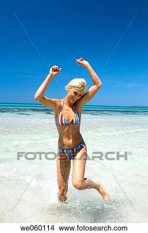 amusement, bathing, bathe, Arms raised, action View Large Photo Image Picture - amusement, bathing, bathe, Arms raised, action. Fotosearch