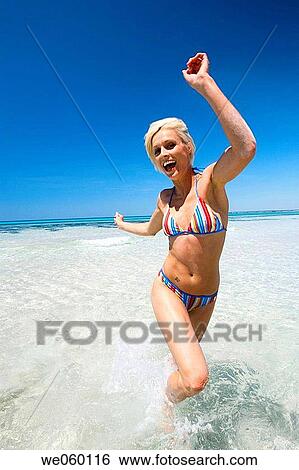 amusement, bathing, bathe, Arms raised, action View Large Photo Image Stock Photograph - amusement, bathing, bathe, Arms raised, action. Fotosearch
