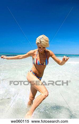 Stock Photography - amusement, beach, bathing, bathe, action. Fotosearch
