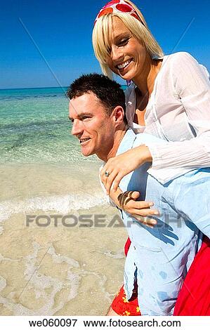 Stock Photo - amusement, bonding, bond, beach, affection. Fotosearch