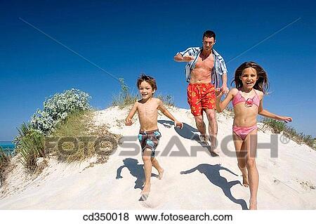 Stock Photo - amusement, boy, beach, action. Fotosearch