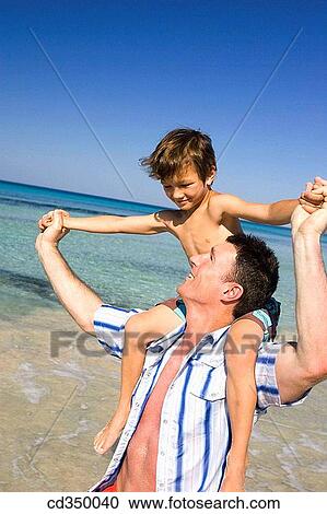 amusement, boy, beach, Arms open, affection View Large Photo Image Stock Image - amusement, boy, beach, Arms open, affection. Fotosearch