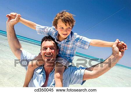 amusement, boy, beach, Arms open, affection View Large Photo Image Stock Photography - amusement, boy, beach, Arms open, affection. Fotosearch