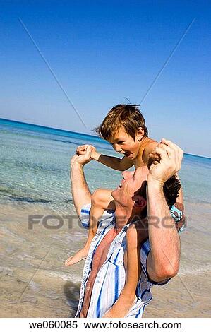 amusement, boy, beach, Arms open, affection View Large Photo Image Stock Photography - amusement, boy, beach, Arms open, affection. Fotosearch