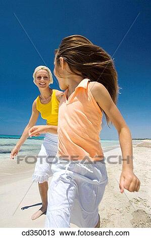 amusement, carefree, beach, barefoot, action View Large Photo Image Stock Image - amusement, carefree, beach, barefoot, action. Fotosearch