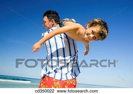 Arms open, blue sky, blue, beach, amusement View Large Photo Image Stock Image - Arms open, blue sky, blue, beach, amusement. Fotosearch