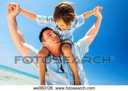 Arms open, blue sky, blue, beach, amusement View Large Photo Image Stock Photograph - Arms open, blue sky, blue, beach, amusement. Fotosearch