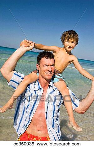 Arms open, boy, beach, amusement View Large Photo Image Stock Photography - Arms open, boy, beach, amusement. Fotosearch