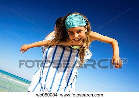 Arms open, carefree, beach, amusement View Large Photo Image Picture - Arms open, carefree, beach, amusement. Fotosearch