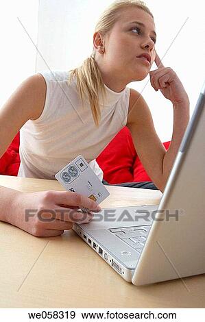 at-home, blond, Bank card, absorbed View Large Photo Image Stock Photo - at-home, blond, Bank card, absorbed. Fotosearch