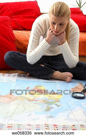 Stock Photography - at-home, bored, blond, barefoot, absorbed. Fotosearch