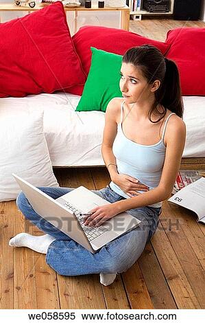 Stock Photography - at-home, brunette, absorbed. Fotosearch