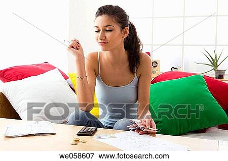 at-home, calculate, bill, banknote, absorbed View Large Photo Image Stock Photo - at-home, calculate, bill, banknote, absorbed. Fotosearch