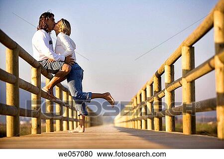 attraction, bond, boardwalk, barefoot, affection View Large Photo Image Stock Image - attraction, bond, boardwalk, barefoot, affection. Fotosearch