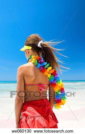 Stock Image - back view, beach, blue, blue sky, calm. Fotosearch