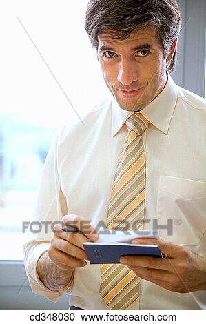 Ball-point pen, black hair, business, businessman, businesspeople View Large Photo Image Stock Image - Ball-point pen, black hair, business, businessman, businesspeople. Fotosearch
