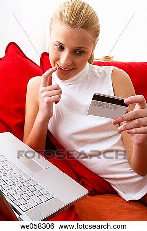 Bank card, blond, at-home View Large Photo Image Stock Photograph - Bank card, blond, at-home. Fotosearch