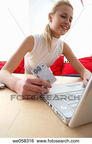 Bank card, blond, at-home View Large Photo Image Stock Photograph - Bank card, blond, at-home. Fotosearch