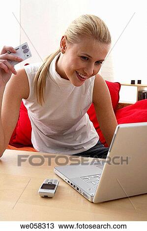Bank card, cell phone, blond, at-home View Large Photo Image Stock Image - Bank card, cell phone, blond, at-home. Fotosearch