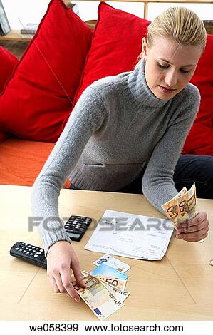 Stock Photo - banknote, calculating, calculate, bill, at-home. Fotosearch