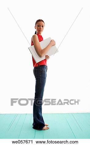 Stock Image - barefoot, brunette, androgyne. Fotosearch