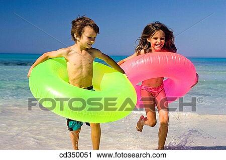 bathe, boy, beach, bathing, amusement View Large Photo Image Stock Image - bathe, boy, beach, bathing, amusement. Fotosearch