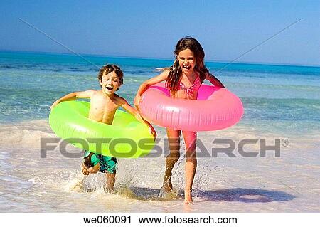 bathe, boy, beach, bathing, amusement View Large Photo Image Stock Image - bathe, boy, beach, bathing, amusement. Fotosearch