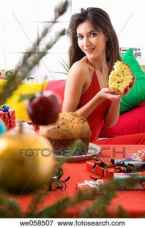 Stock Photo - bauble, celebrate, brunette, at-home. Fotosearch