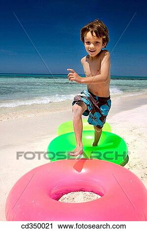 Stock Image - beach, activity, amusement, agility, agile, action. Fotosearch