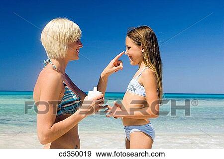 beach, Body care, apply View Large Photo Image Stock Photo - beach, Body care, apply. Fotosearch