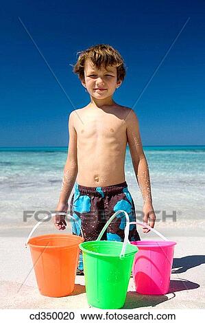 beach, boy, bucket, child, childhood View Large Photo Image Stock Image - beach, boy, bucket, child, childhood. Fotosearch