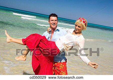 Stock Photo - beach, carefree, bonding, bond, affection. Fotosearch