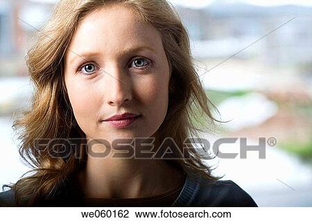 Stock Image - blond, blue eyes, business, businesspeople, businesswoman. Fotosearch
