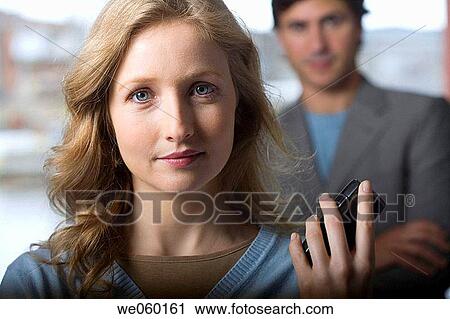 Stock Image - blond, blue eyes, businessman, businesspeople, businesswoman. Fotosearch