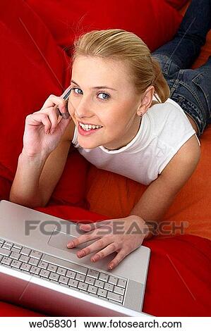 Stock Image - blond, calling, business, appointment. Fotosearch