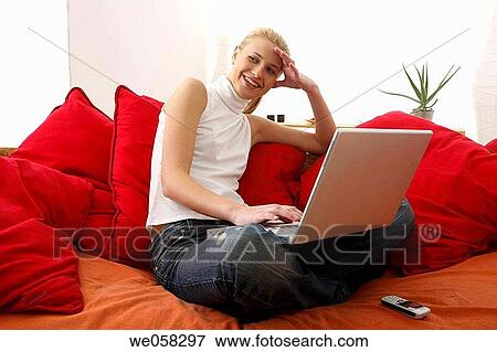 Stock Photo - blond, cell phone, business, at-home. Fotosearch