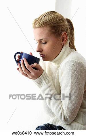 Stock Image - blond, cold, blue eyes, absorbed. Fotosearch