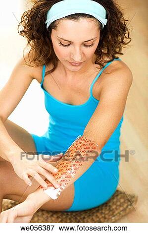 Stock Photo - Body care, brunette, arm. Fotosearch