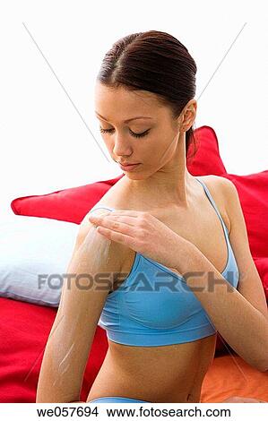 Picture - Body care, carnality, brunette, apply. Fotosearch