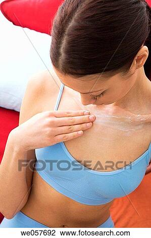 Stock Image - Body care, carnality, brunette, apply. Fotosearch