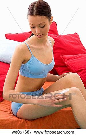 Body care, carnality, brunette, apply View Large Photo Image Stock Photo - Body care, carnality, brunette, apply. Fotosearch
