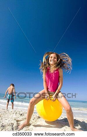 boy, activity, beach, ball, amusement, action View Large Photo Image Stock Image - boy, activity, beach, ball, amusement, action. Fotosearch