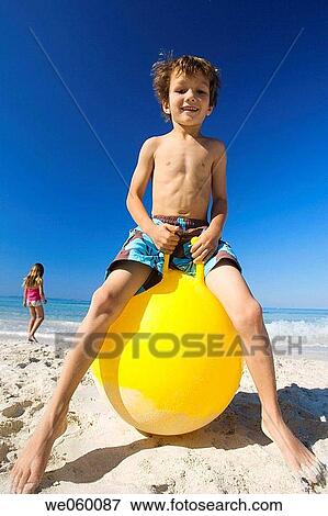brother, ball, boy, beach, barefoot, amusement View Large Photo Image Stock Photo - brother, ball, boy, beach, barefoot, amusement. Fotosearch