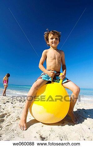 brother, ball, boy, beach, barefoot, amusement View Large Photo Image Stock Photo - brother, ball, boy, beach, barefoot, amusement. Fotosearch
