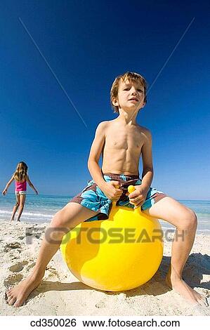 brother, ball, boy, beach, barefoot, amusement View Large Photo Image Stock Photograph - brother, ball, boy, beach, barefoot, amusement. Fotosearch