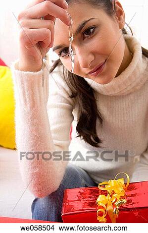brunette, celebrate, at-home View Large Photo Image Picture - brunette, celebrate, at-home. Fotosearch