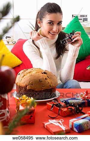 Stock Photography - brunette, celebrate, at-home. Fotosearch