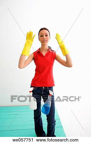 Stock Image - brunette, cleaning, clean, Arms raised. Fotosearch