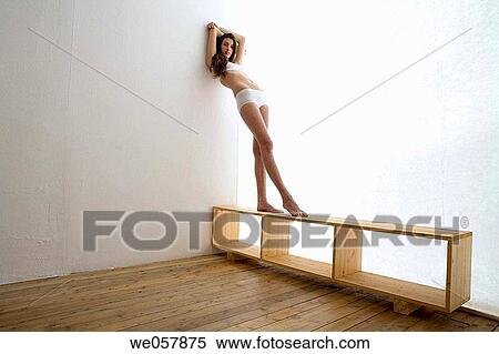 Stock Photography - brunette, contemporary, Arms raised. Fotosearch