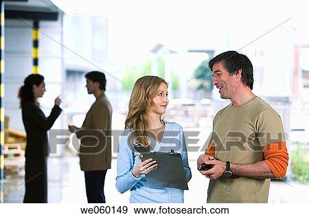 Stock Photo - businessman, businesswoman, businesspeople, Attache case. Fotosearch